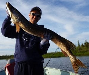 Man posing with a pike