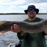 Man holding a pike