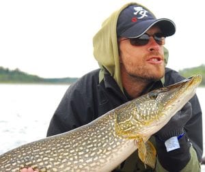 Man posing with a pike